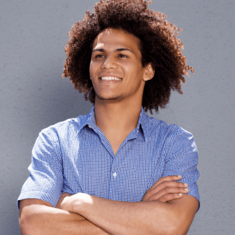 demo-attachment-493-smiling-confident-man-standing-with-arms-crossed-DMBEGAW